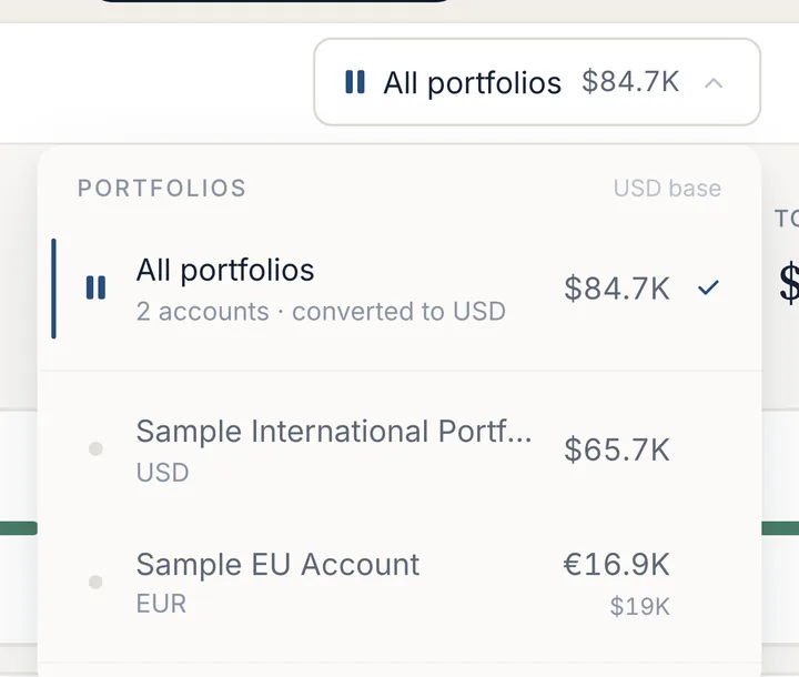 The portfolio switcher open: All portfolios, two accounts converted to USD, then each account with its currency and value.
